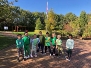 Children dressed in green for Macmillan fundraising