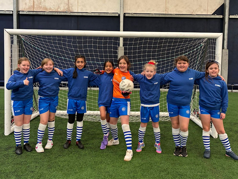 Our girls' football team at the WBA Dome