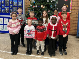Children wearing their Christmas jumpers