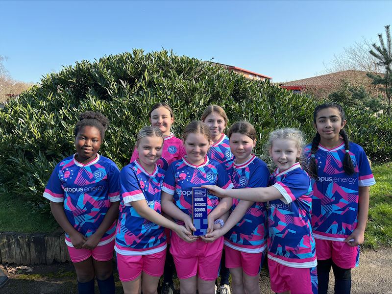 Pupils proudly displaying our Equal Access Award trophy