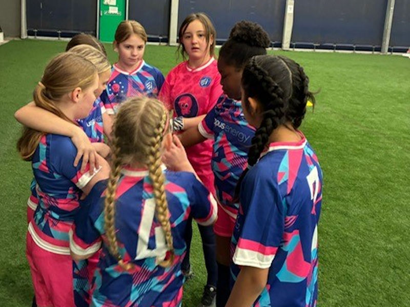 Our girls wearing their new football kit