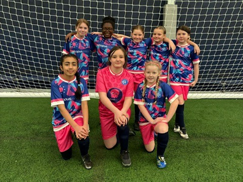 Our girls wearing their new football kit